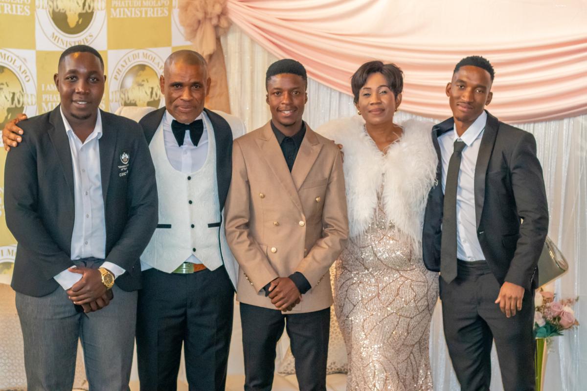 Pastor Phatudi Molapo and ministry family standing together